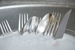 Dirty Dishes Washing in Kitchen Sink