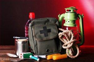 emergency kit with supplies for light, food, and first aid