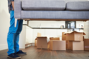 Man Carrying Sofa