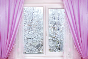 window with pink curtains and winter view outside