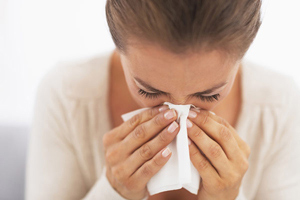 Woman Sneezing